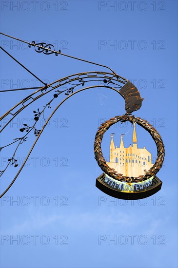 Nose sign from Hotel Kloster Post against blue sky