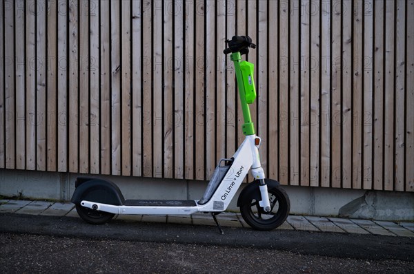 Electric scooter parked on the side of the road at the bike rental company Lime