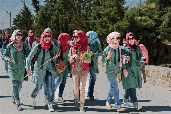 A group of colourfully dressed young woman