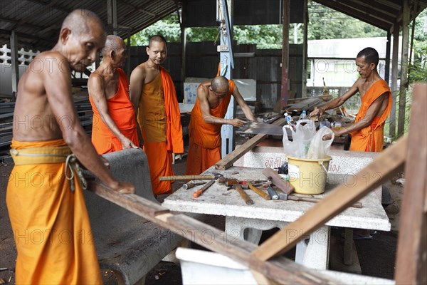 Monks working with wood