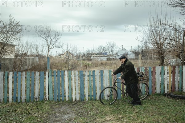 A man on his bicycle on his way home