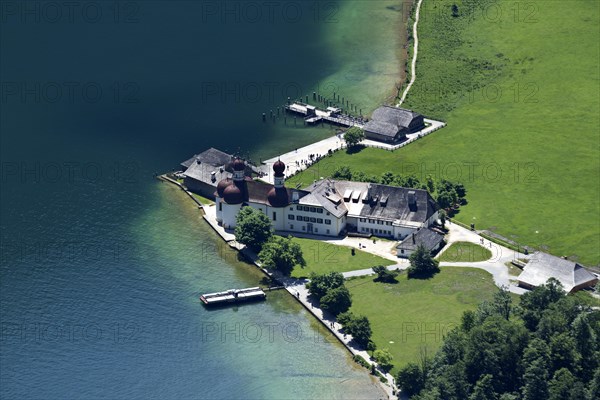 Catholic pilgrimage church of St. Bartholomae and former hunting lodge of the prince princes of Berchtesgaden on the shore of Lake Koenigssee