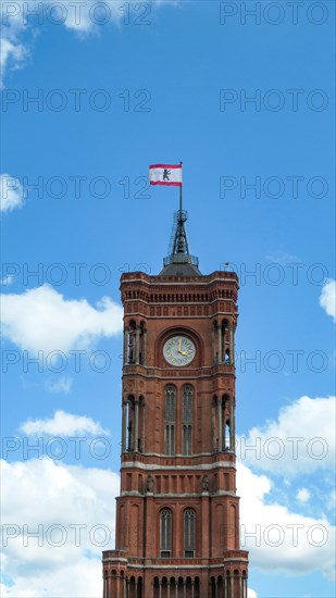 The tower of the Berlin City Hall with the flag of the city arms of Berlin