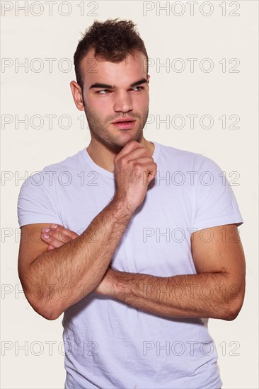 Man with chin on fist thinking