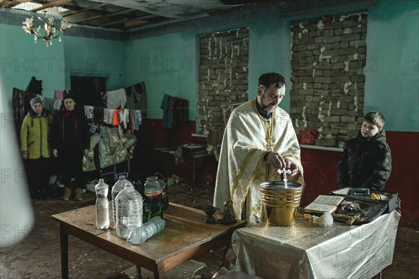 Water consecration in the destroyed church in the village of Novohrihorivka. The small village was almost completely destroyed during the fighting