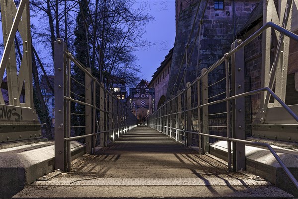 Chain footbridge in evening illumination