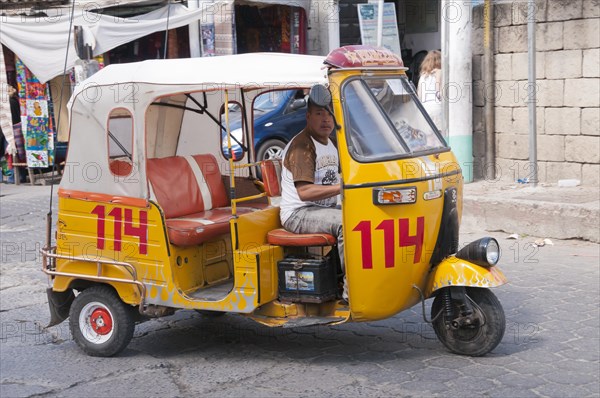 Yellow tuk tuk taxi