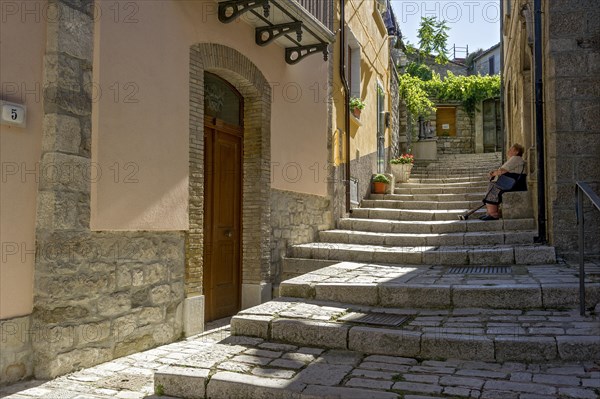 Narrow alley with stairs in old town