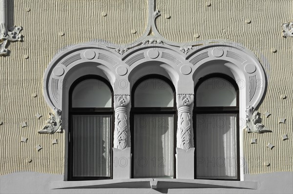 Art Nouveau ornaments on the window of a house facade around 1900