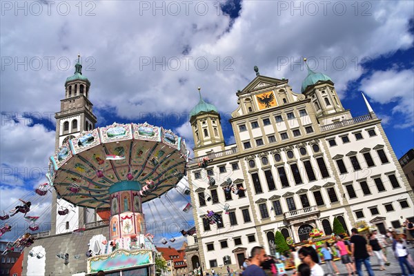 Chain carousel on Augsburgs town hall square in front of the town hall and the Perlachturm