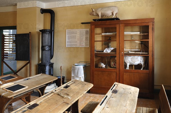 Classroom with cannon stove and biology cupboard