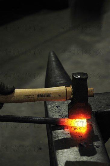 Forging iron on an anvil