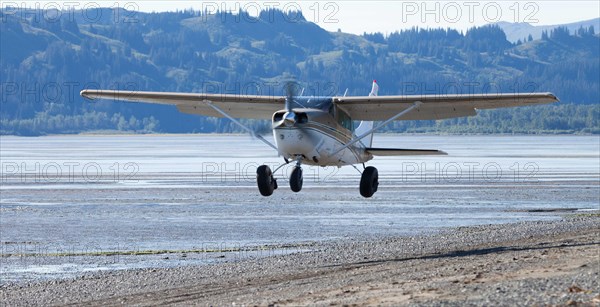 Cessna takes off from the beach in Katmai National Park