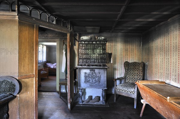 Parlour around 1900 with tiled stove in farmhouse built in 1772