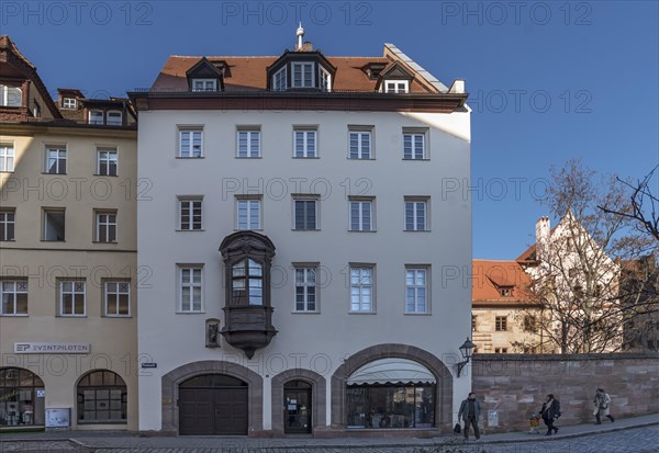 Historic residential and commercial building with a small choir