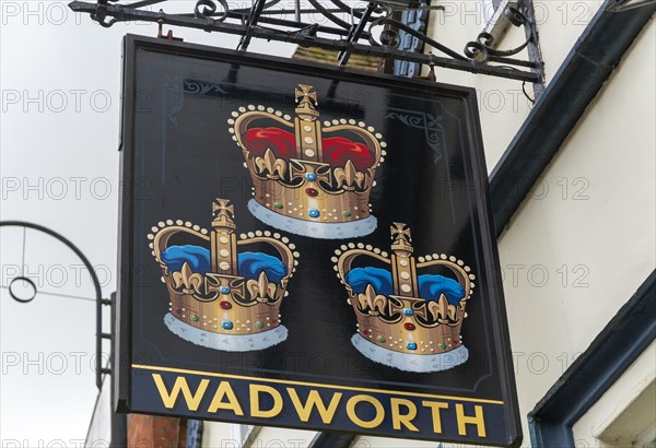 Pub sign for Wadworth brewery Three Crowns inn