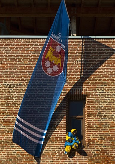 Flag of the twin town Saint-James France and Moehne in the window of the castle at carnival time