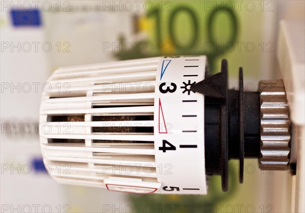 Thermostat in front of euro note