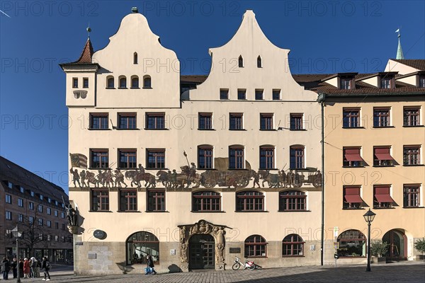 Chamber of Industry and Commerce with a mural depicting a medieval merchant procession