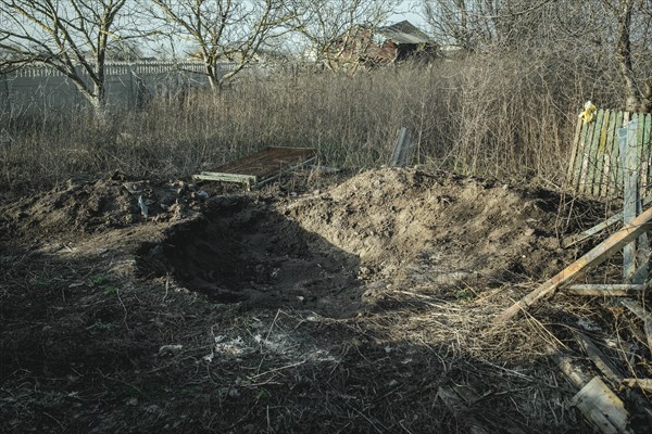 Human remains at a grave where the bodies of six civilians from Praviden were temporarily given a makeshift burial after being tortured and then executed by Russian soldiers