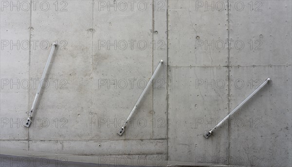 Fluorescent tube on bare concrete wall