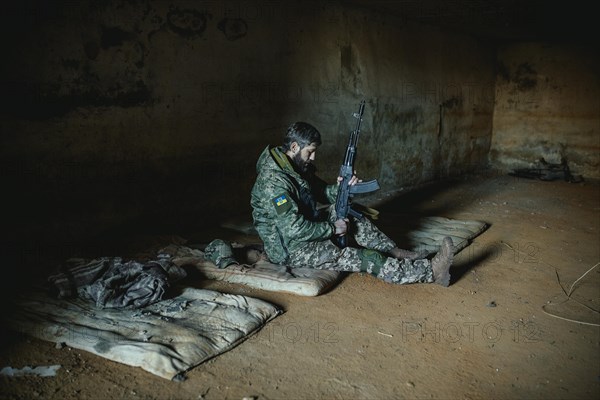 Soldier on his sleeping pad in his units accommodation