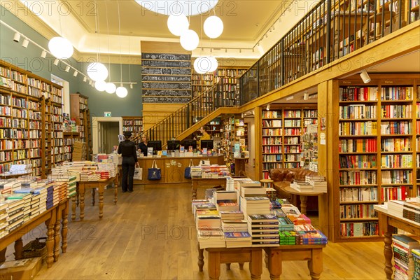 Bookshelves and piles of books