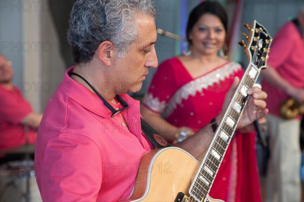 Jazz guitarist Lorenzo Petrocca at a concert on the premises of the Olymp company