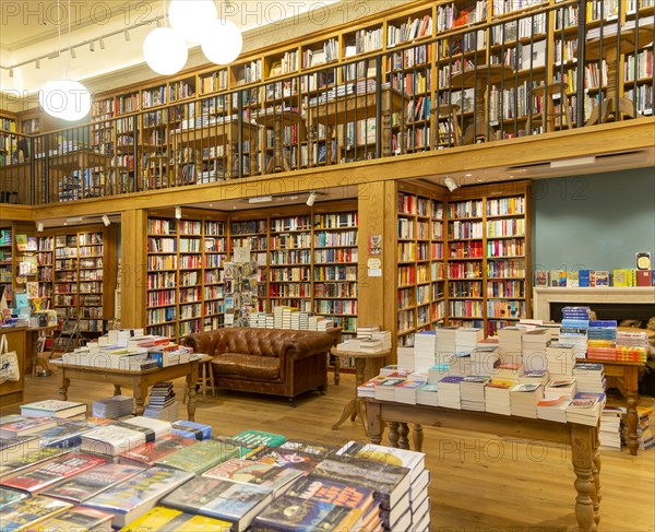 Bookshelves and piles of books