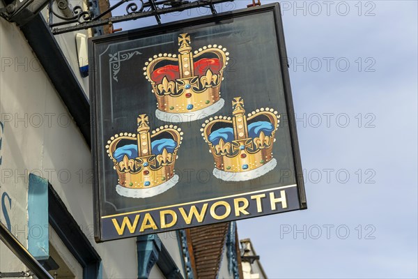 Pub sign for Wadworth brewery Three Crowns inn