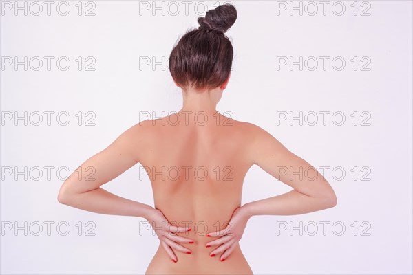 Half naked woman with aching back