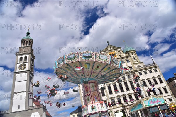 Chain carousel on Augsburgs town hall square in front of the town hall and the Perlachturm