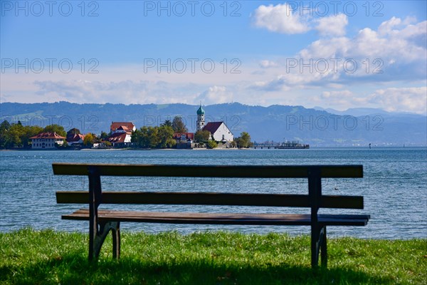View of the Catholic parish church of St. George on the peninsula in moated castle on Lake Constance