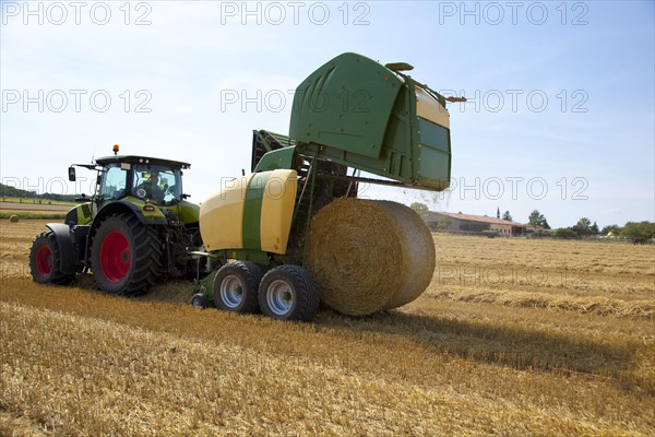 Tractor and round baler