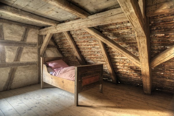 Bed under the roof of a small winegrower