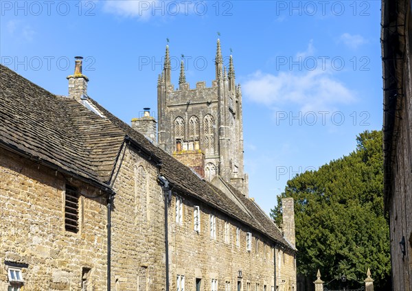 Church tower and historic cottages in New Street