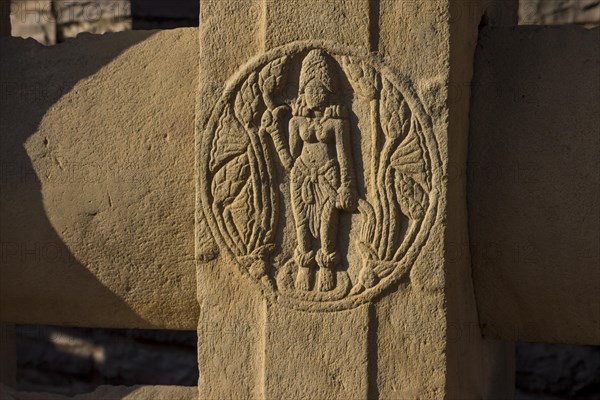 Round motif depicting a woman