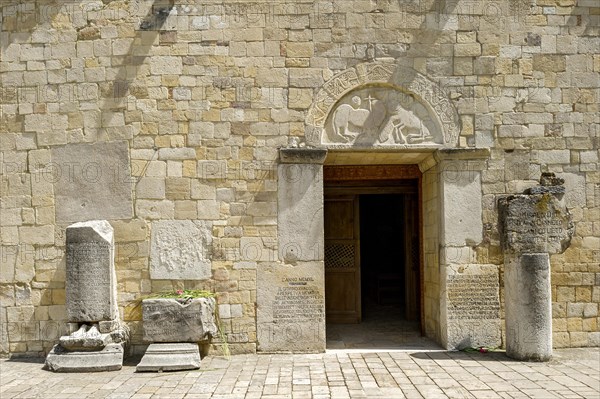 Facade with relief stones and inscriptions