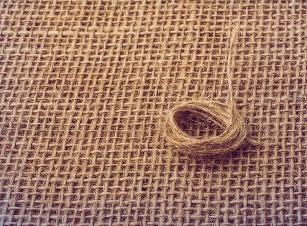 Roll of brown color linen string paper background