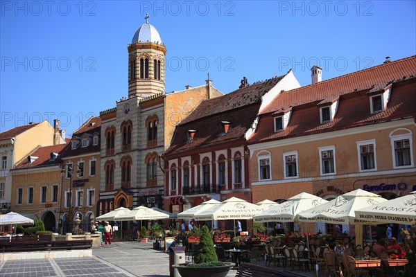 Street cafe in the old town on Piata Sfatului Square of Brasov