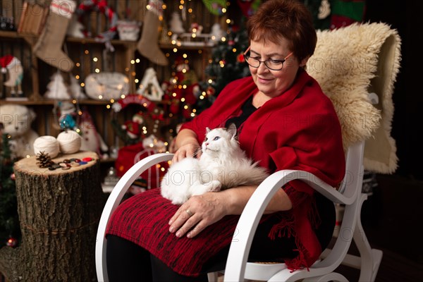 Grandmother is sitting on a rocking chair