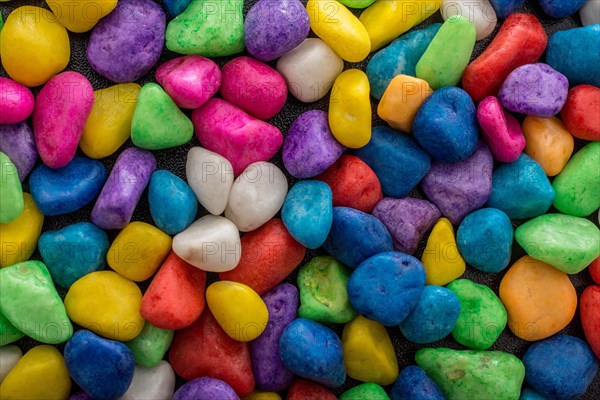 Pile of little colorful pebbles as stone background