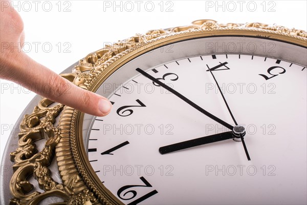 Finger pointing to clock and mechanism