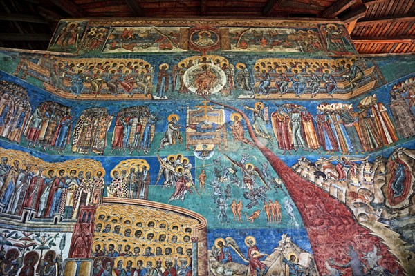 Frescoes on the outer wall. The Voronet Monastery