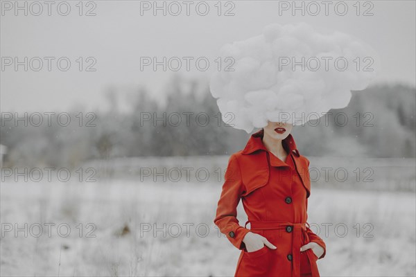 Woman in red coat with cloud on her head in the snow