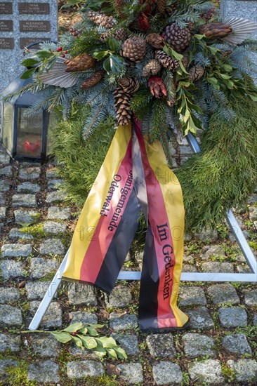 Wreath with black-red-gold ribbon