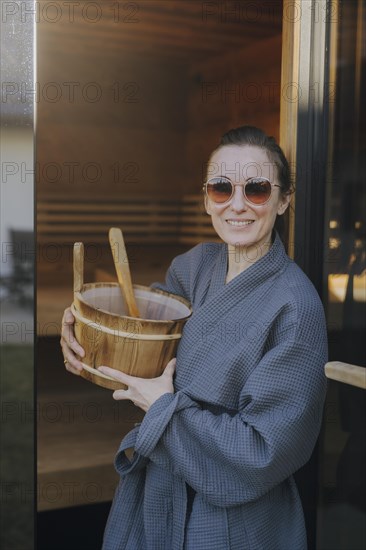 Woman taking a sauna