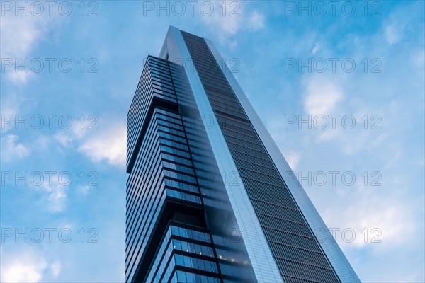 Financial area with glass buildings seen from below at sunrise