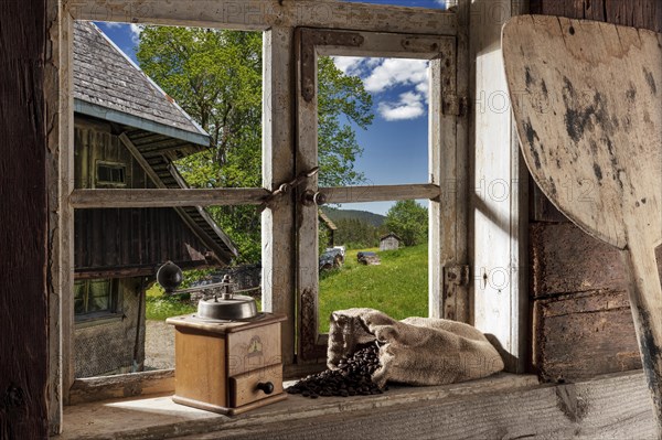 Farmhouse parlour with coffee grinder and coffee beans on the windowsill