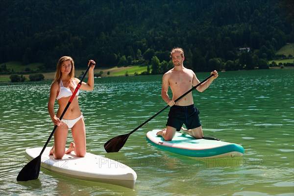 Couple stand-up paddling